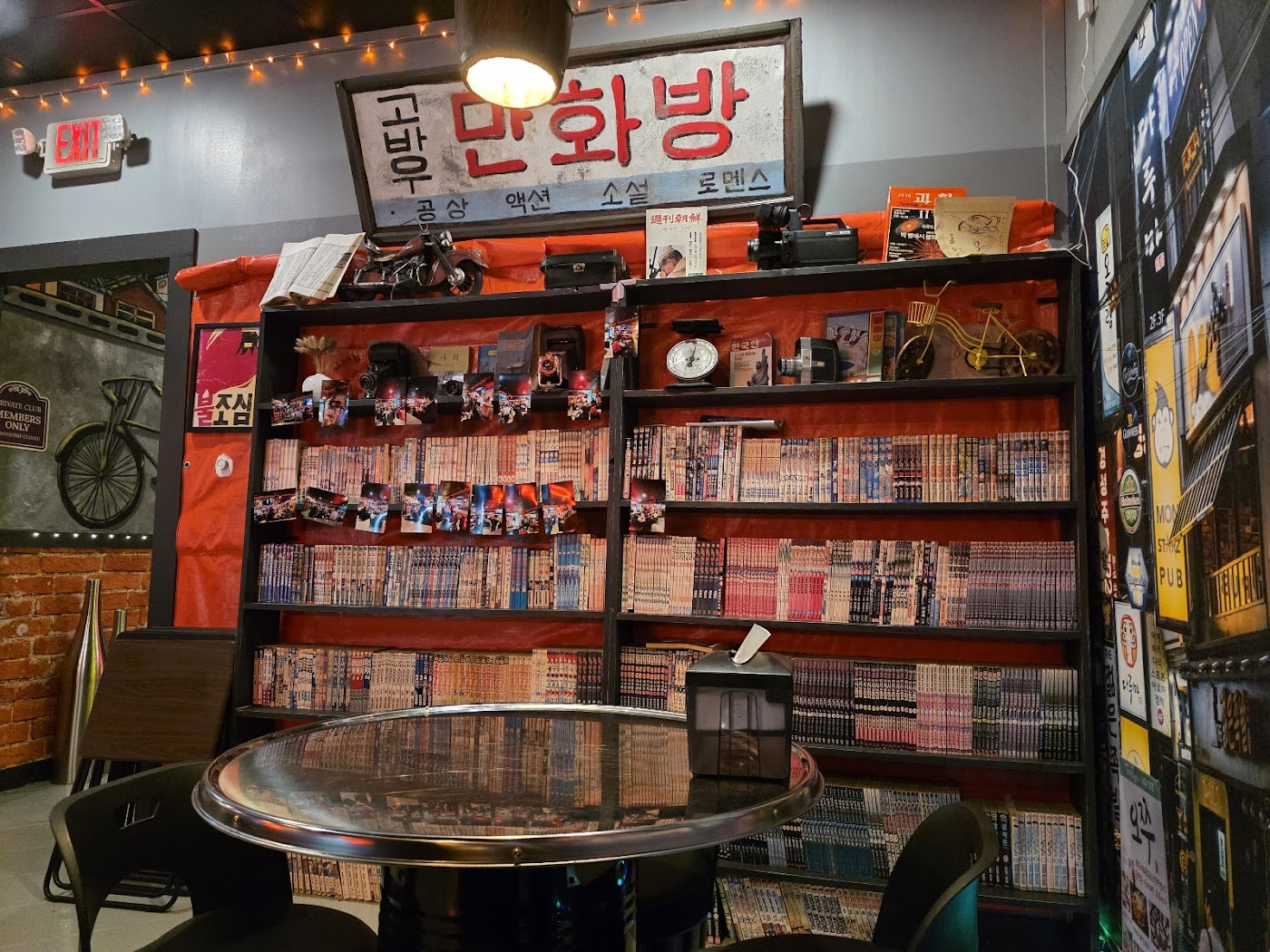 Retro manhwa corner — wall of Korean comics, vintage signage and neon-sign wallpaper